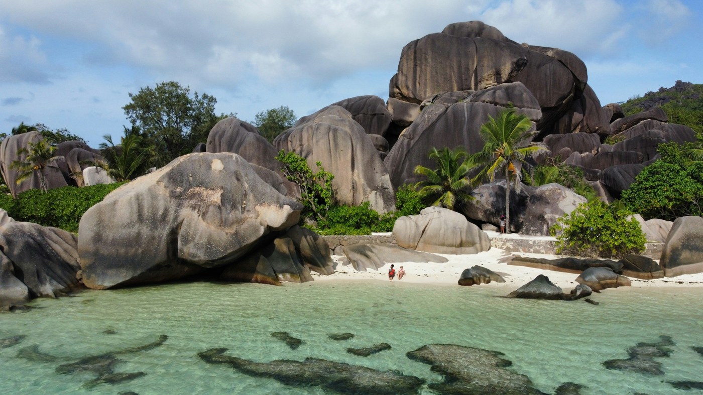 Granite boulders and tropical shoreline — island masterplan context