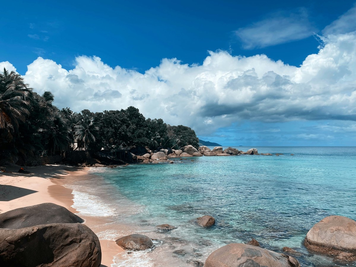 Private moody beach at dusk — secluded shoreline, Indian Ocean
